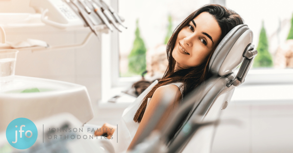 Woman in dentist chair with a smile