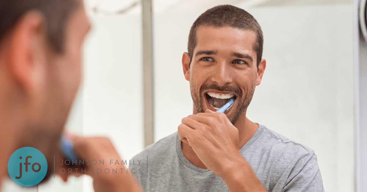 Man brushing teeth