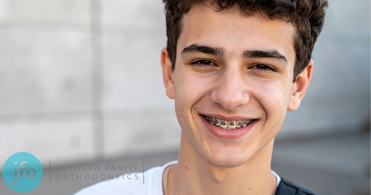 Young man with braces going to school