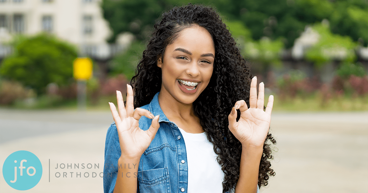 Girl OK symbols with braces